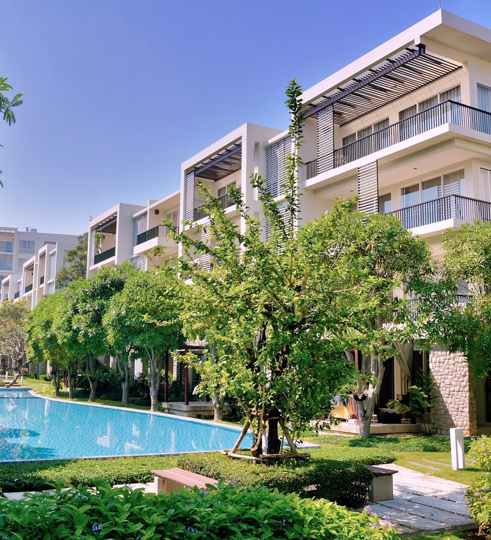 Garden-style apartment complex with a pool